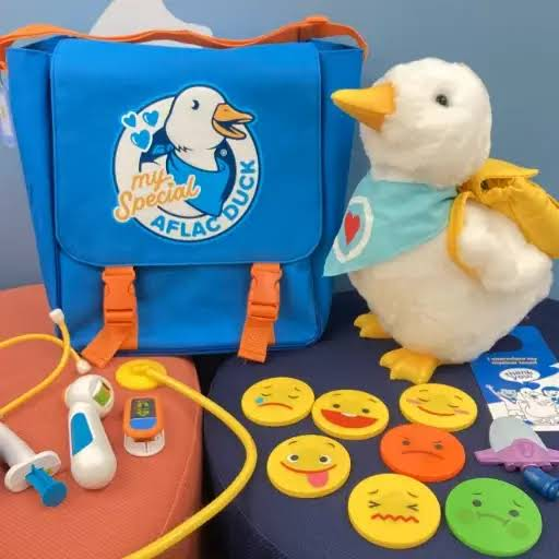 My Special Aflac Duck kit with plush duck, medical play tools, and feeling discs